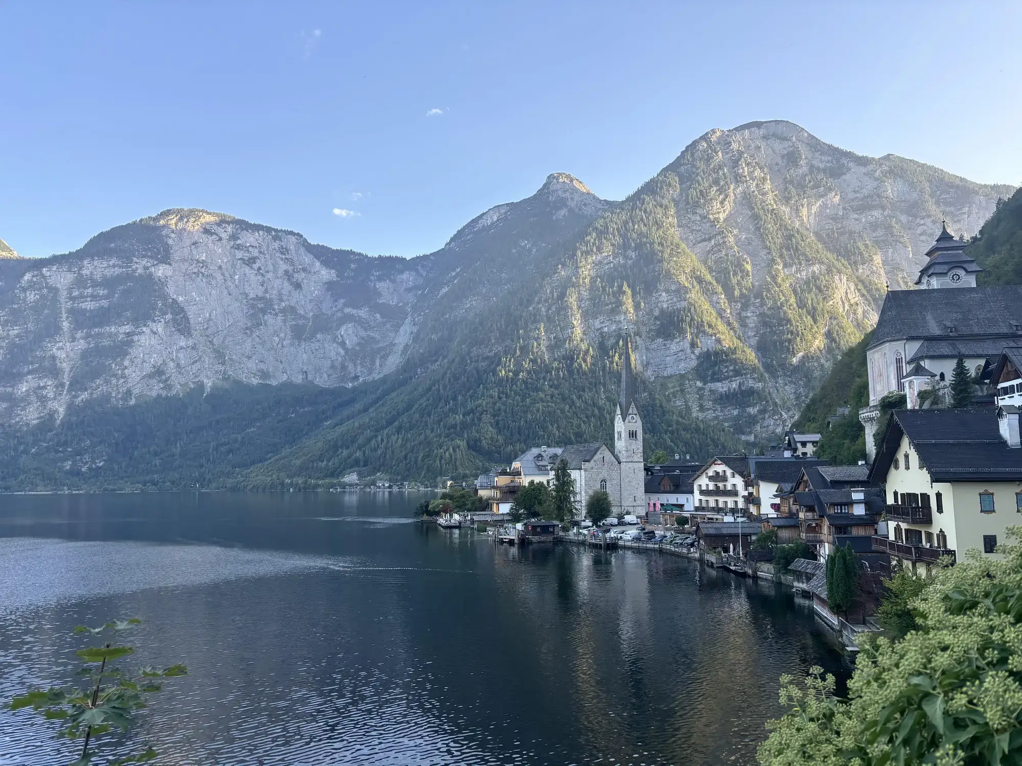 The lakeside village of Hallstatt, Austria, beneath forested mountains